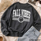 Fall Vibes Sweatshirt in heather charcoal with a white distressed graphic, pumpkin emblem, and stripe details