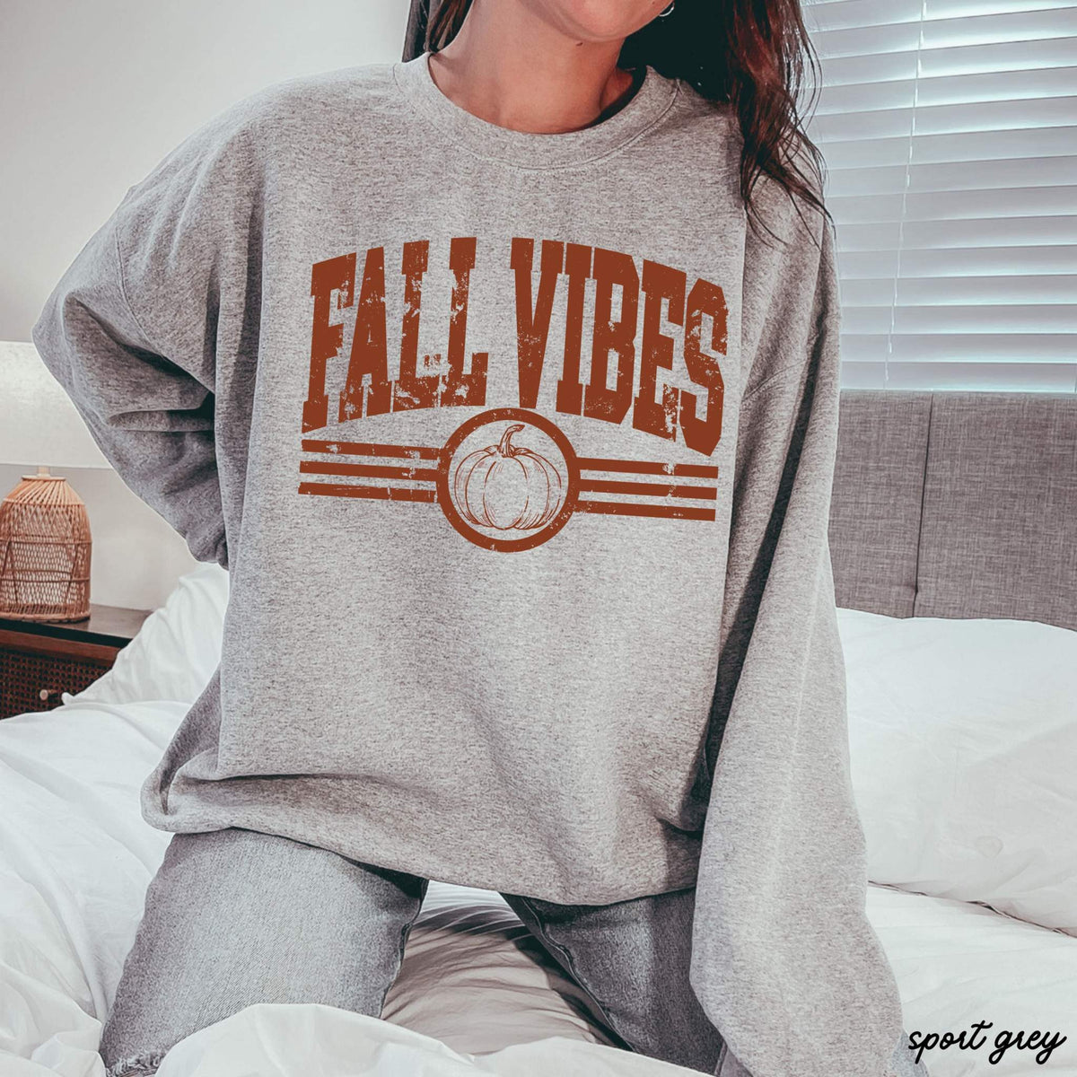 Fall Vibes Sweatshirt in heather gray with distressed rust lettering, pumpkin graphic, and striped accents