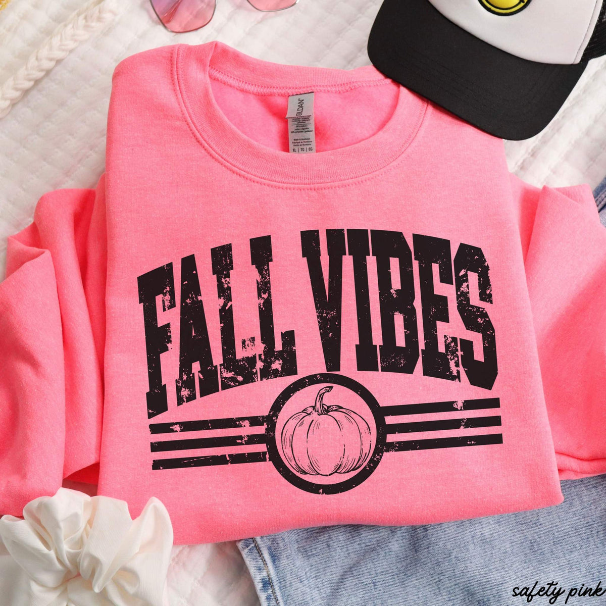 Fall Vibes Sweatshirt in bright safety pink with distressed black lettering, stripes, and pumpkin graphic