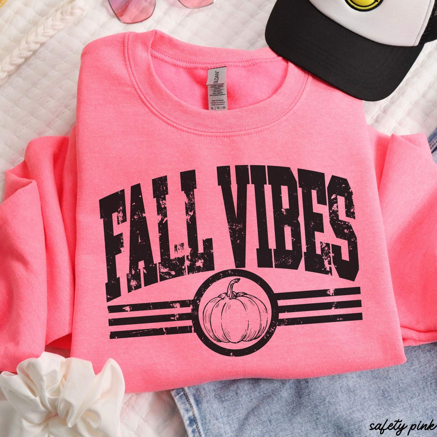 Fall Vibes Sweatshirt in bright safety pink with distressed black lettering, stripes, and pumpkin graphic