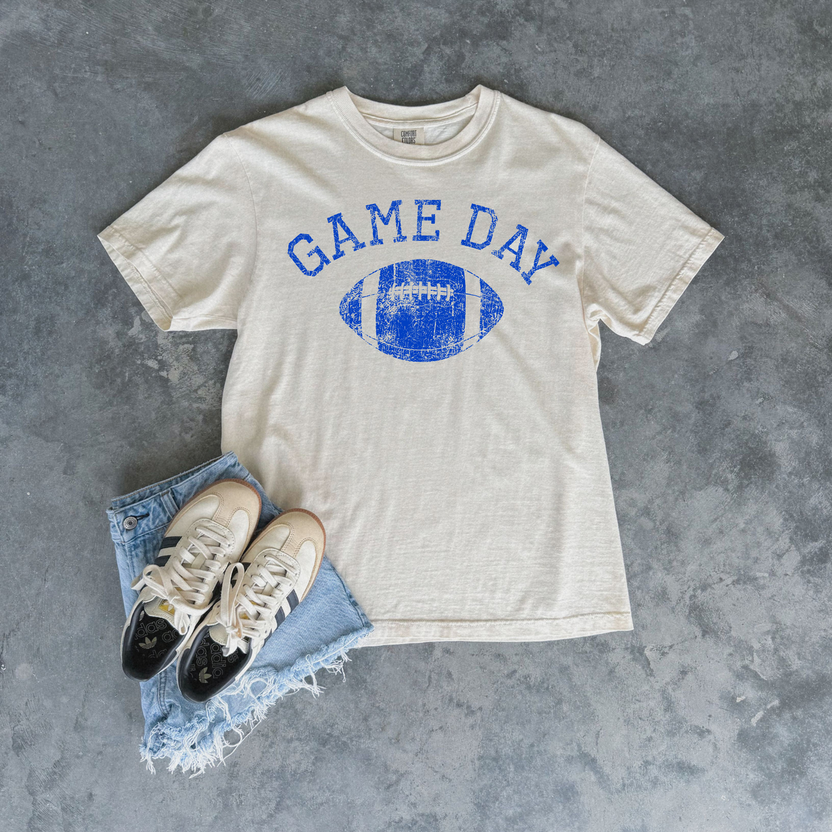 Football Graphic Tee in ivory cotton with distressed blue Game Day lettering and vintage football graphic