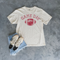 Football Graphic Tee in ivory cotton with distressed red Game Day lettering and football graphic