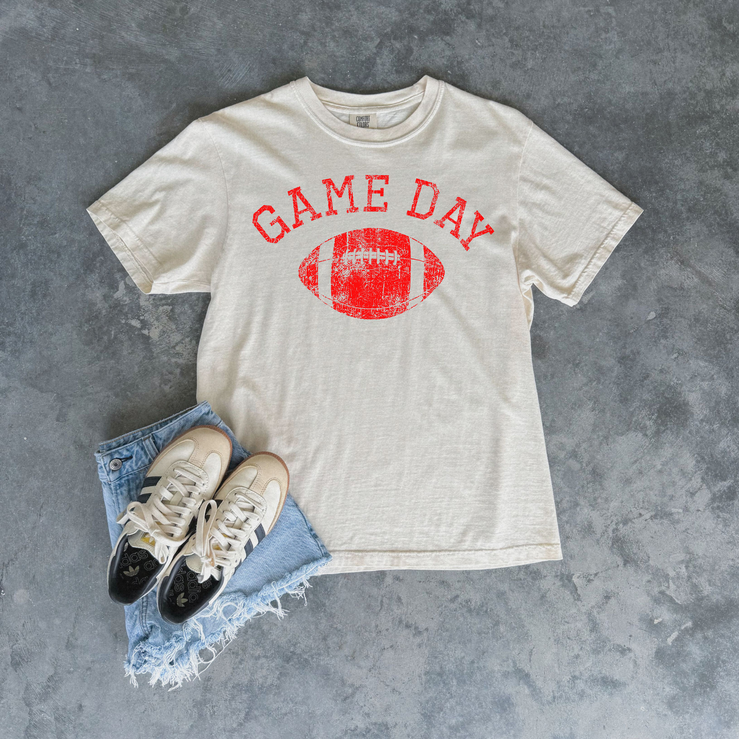 Football Graphic Tee in ivory cotton with red distressed Game Day lettering and football graphic