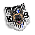 Fur Missiles Police K9 sticker featuring a snarling German Shepherd, bones, flag and bold black lettering
