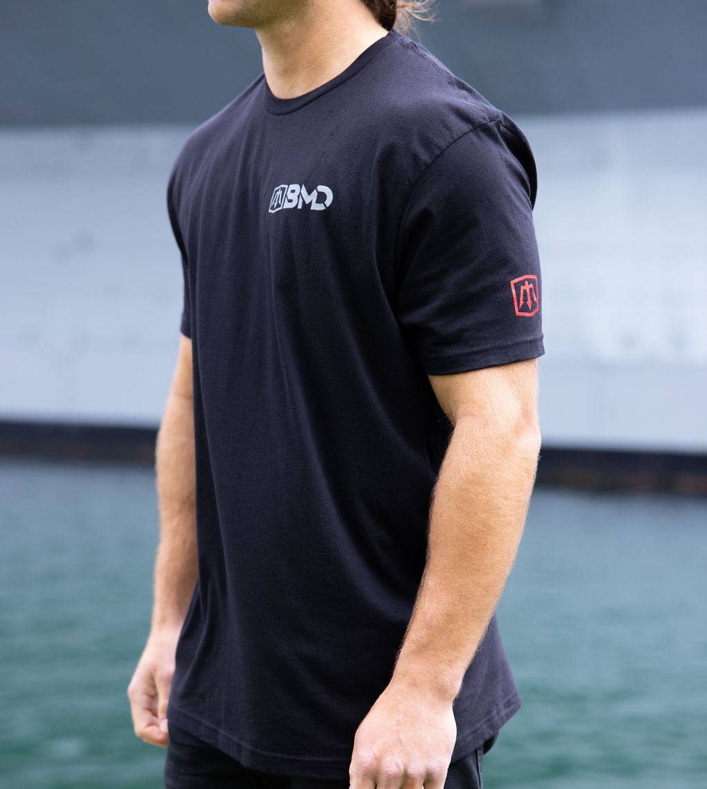 GO DO DANGEROUS SHIT black cotton T-shirt with small chest logo and red sleeve patch
