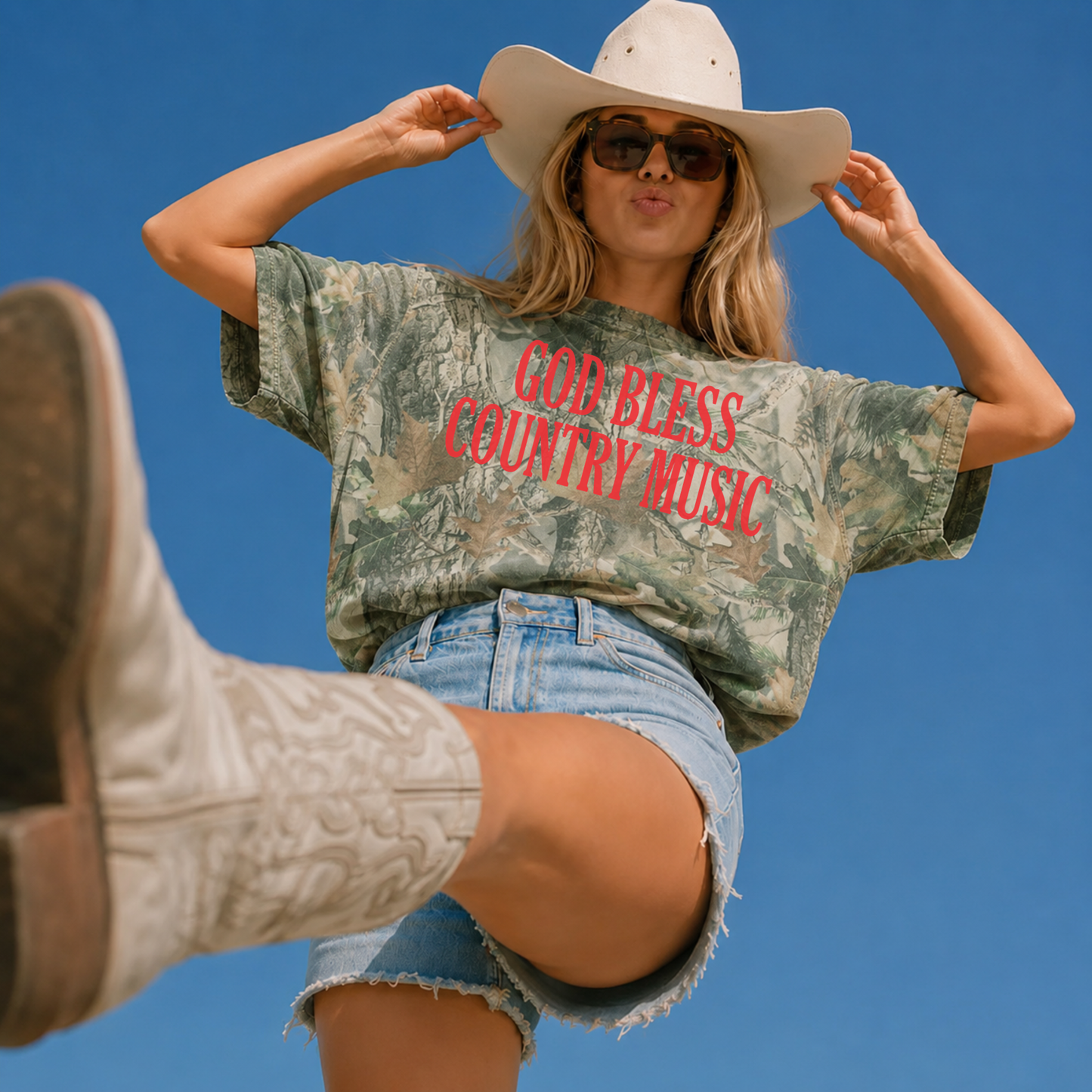 God Bless Country Music oversized green wood camouflage cotton tee with bold red graphic and relaxed boxy fit