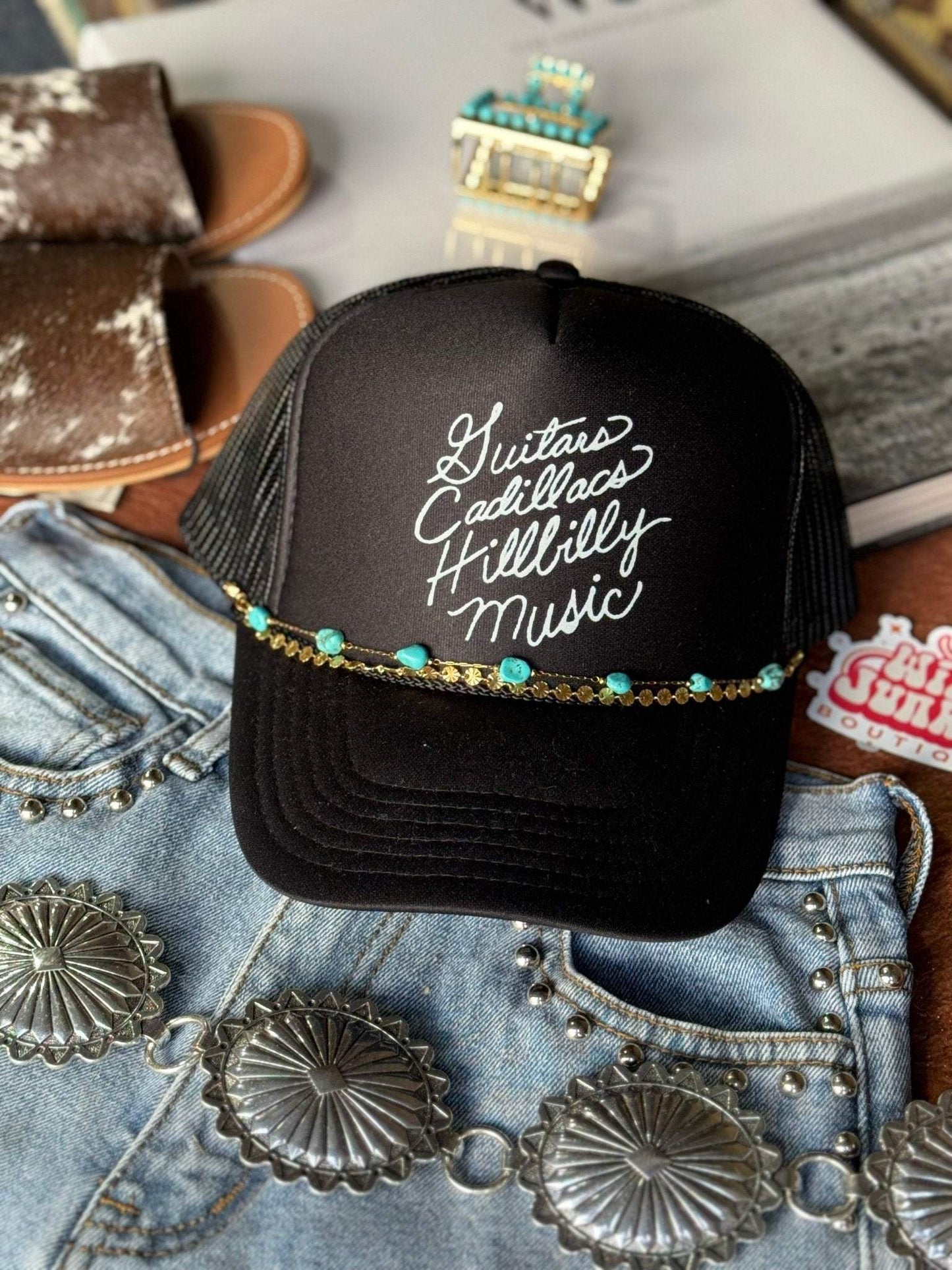 Black Guitars Cadillacs Trucker Hat with breathable mesh back and adjustable snap closure