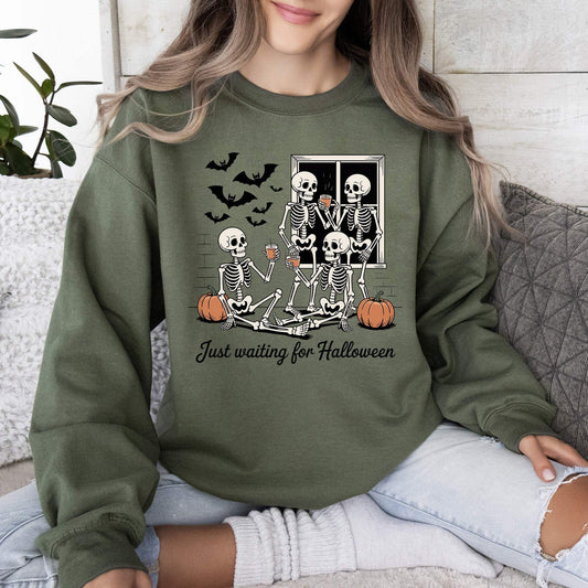 Halloween Skeleton Ghost sweatshirt in olive green with vintage skeleton, ghost, bat, pumpkin, and window graphic