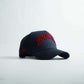 Houston Legacy Snapback in black with red 3D Houston embroidery, curved bill, and structured six-panel crown