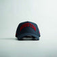 Houston Legacy Snapback in dark navy with red raised Houston embroidery and a curved bill