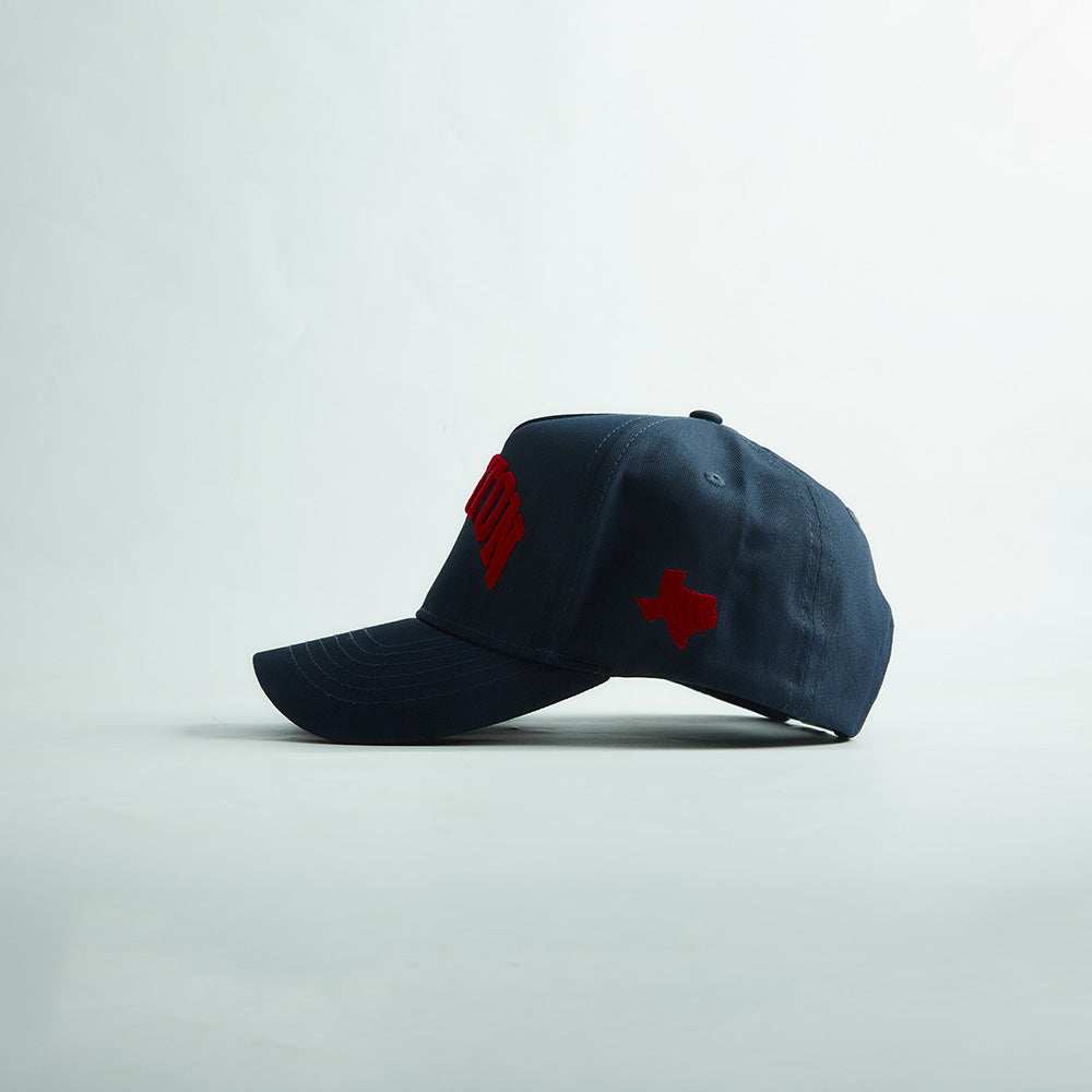 Houston Legacy Snapback in dark navy cotton with red embroidered Houston lettering and Texas side patch