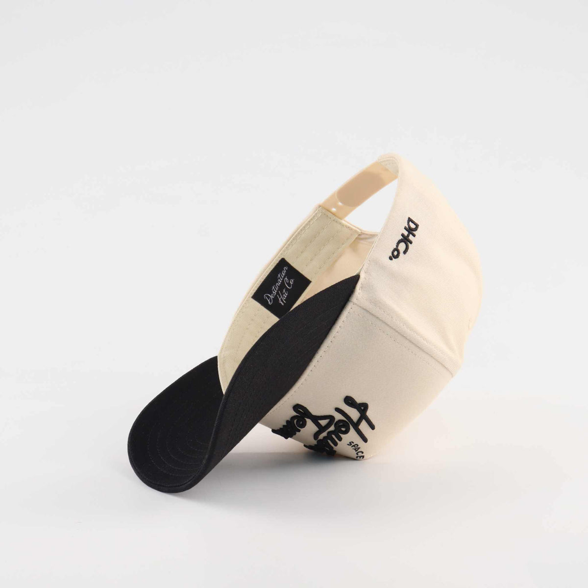 Houston Script Hat in beige and black with embroidered script, curved brim, and structured cotton twill panels