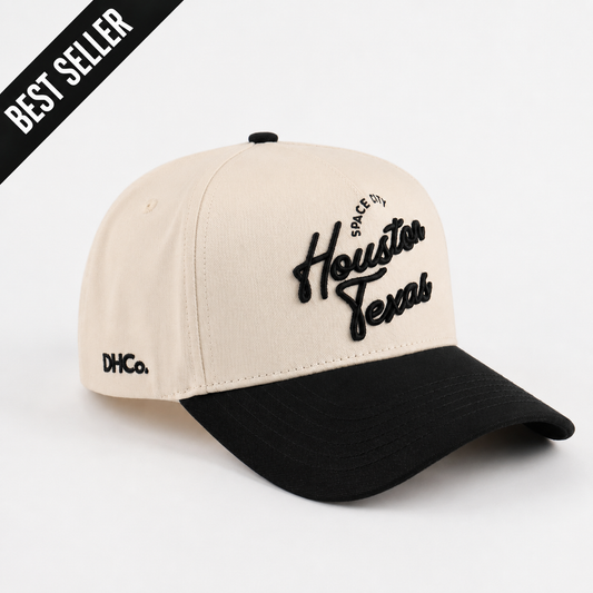 Houston Script Hat in beige cotton with a black curved brim and raised Houston Texas script embroidery