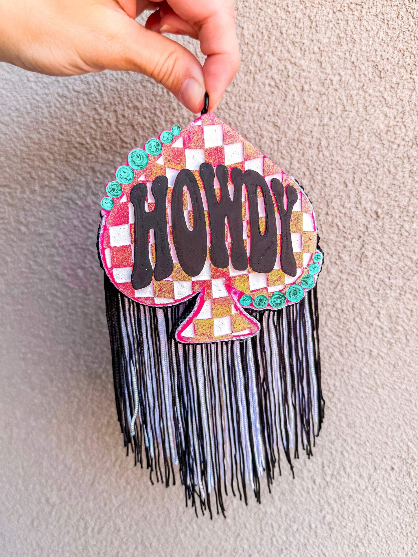 Howdy Spade Freshie in a pink and white checkered spade shape with bold black lettering and fringe