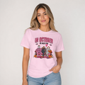 T-shirt featuring In October We Wear Pink Breast Cancer Awareness design on a pink cotton shirt with horror characters and pumpkins