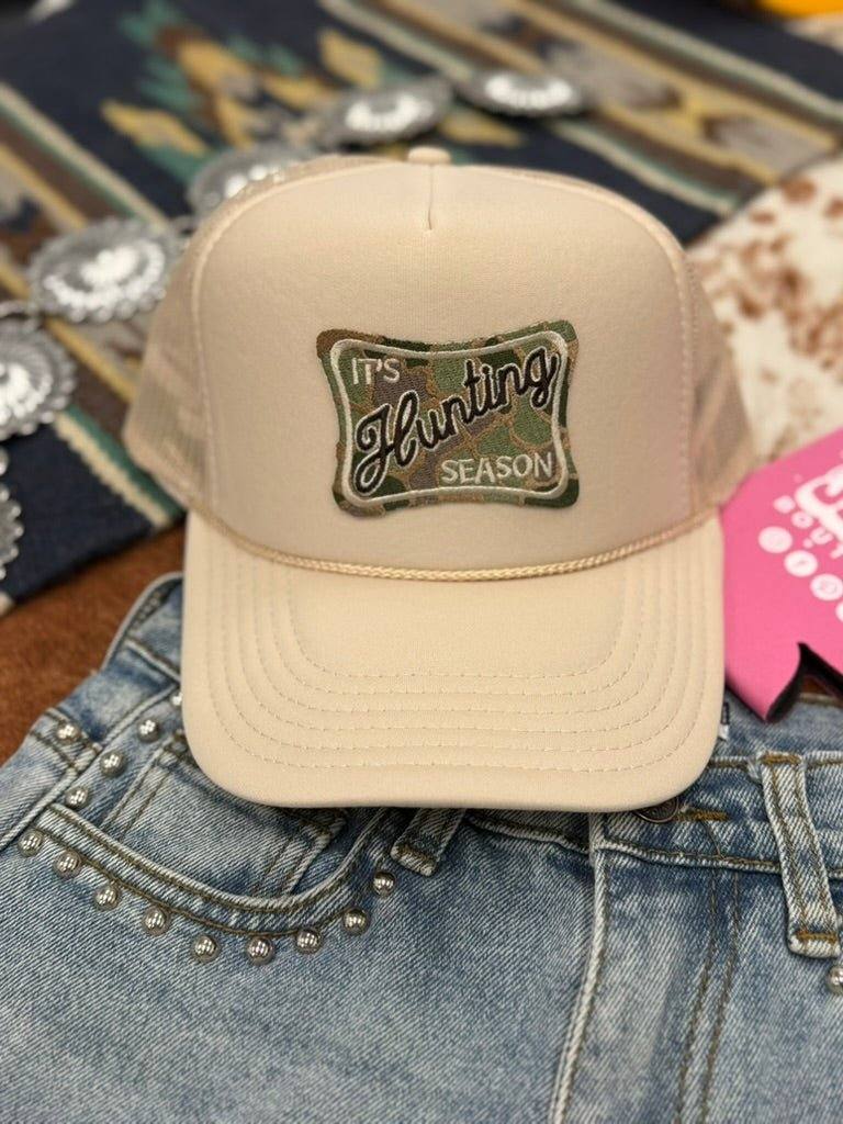Black trucker hat with breathable mesh and adjustable snap back featuring Hunting Season patch