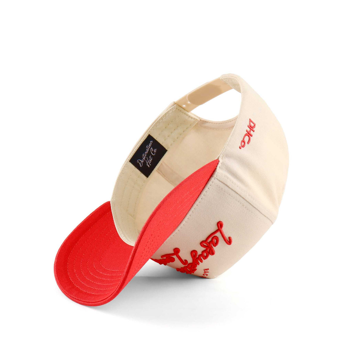 Lafayette Script Hat in beige and red with embroidered script, curved brim, and adjustable back closure