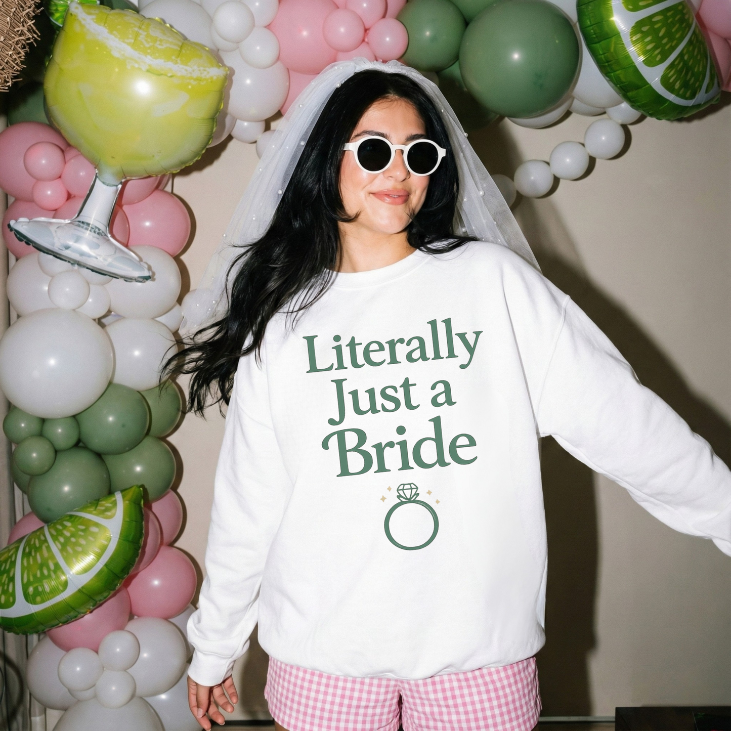 Bride sweatshirt in white cotton with green “Literally Just a Bride” lettering and engagement ring graphic, crew neck and relaxed fit