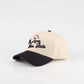 Lone Star Script Hat in beige with a black pre-curved brim and embroidered script front