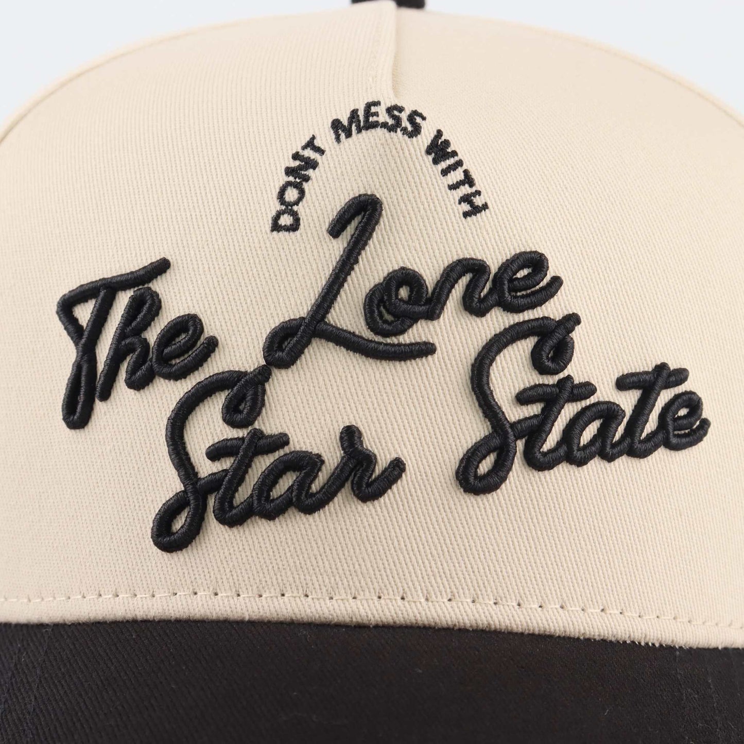 Lone Star Script Hat in beige with raised black embroidered script and pre-curved brim