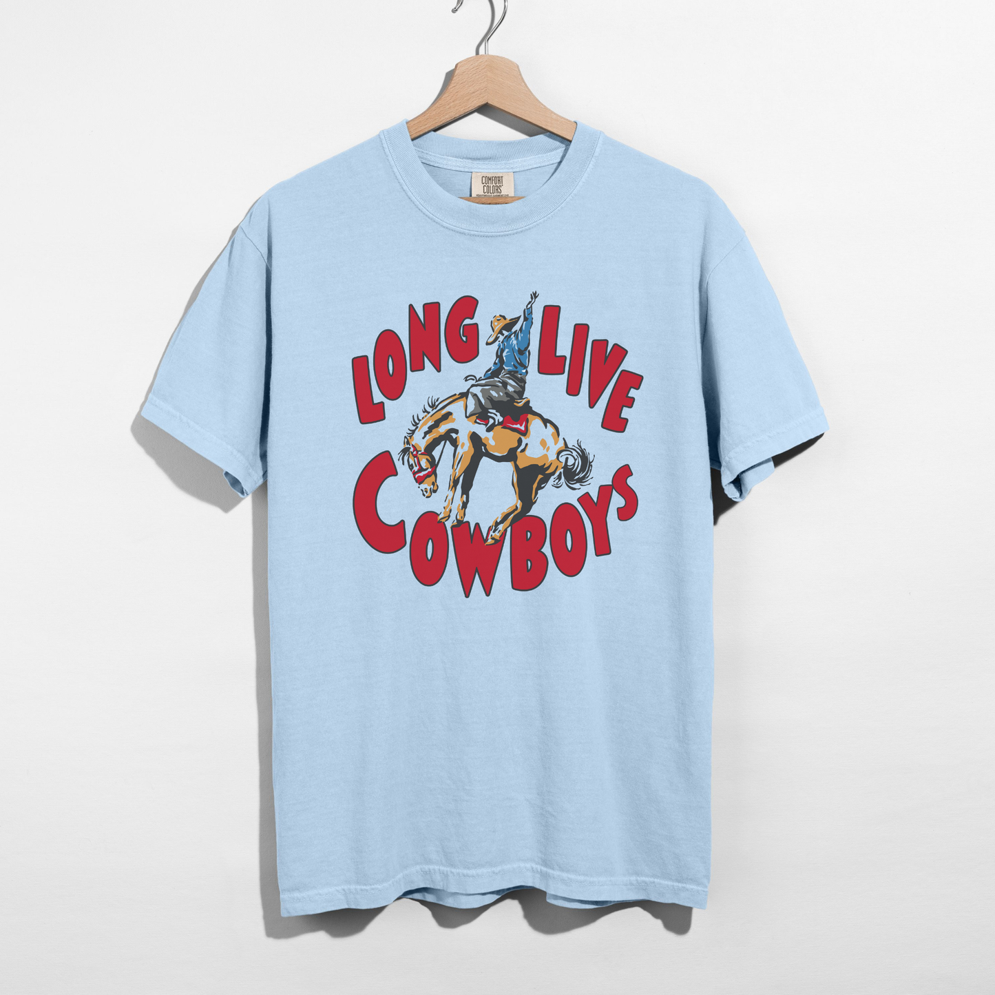 Long Live Cowboys Graphic Tee in light blue with a retro bucking horse and rider graphic and bold red lettering