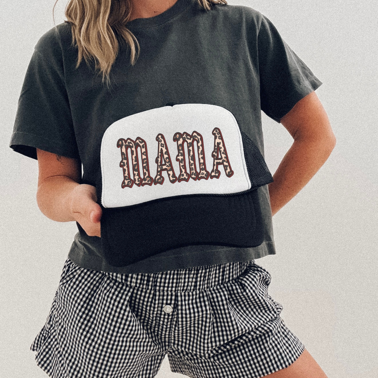 MAMA Leopard Trucker Hat with black mesh and white front panel, featuring bold leopard-print lettering