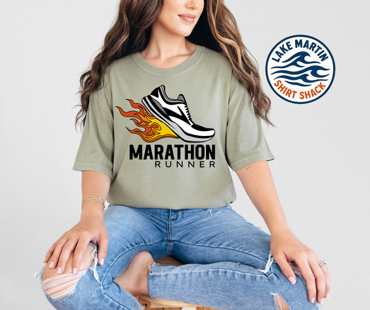 Person wearing a t-shirt with a marathon runner design