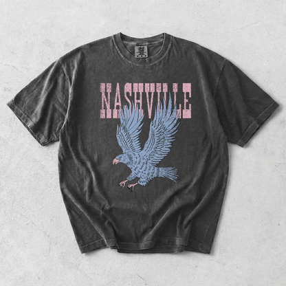 Nashville Eagle Graphic Tee in black cotton with distressed pink lettering and a blue flying eagle graphic