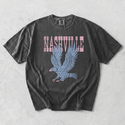 Nashville Eagle Graphic Tee in black cotton with distressed pink lettering and a blue flying eagle graphic