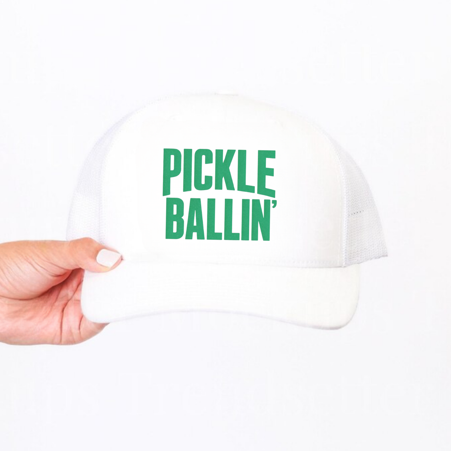 Pickle Ballin’ Trucker Hat with white foam front, mesh back, curved brim, and bold green printed lettering