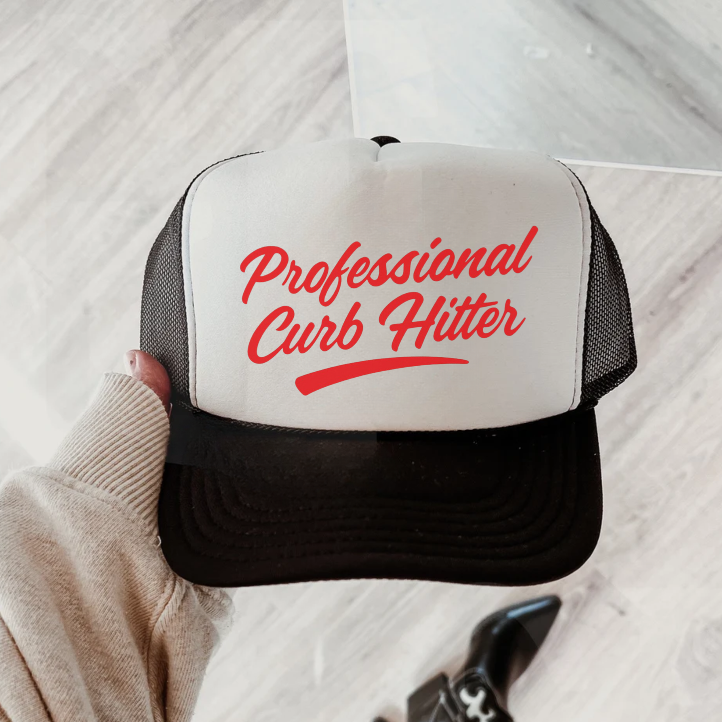 Professional Curb Hitter Trucker Hat in white and black foam-front mesh cap with red script lettering