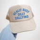 Really Busy Dilly Dallying Trucker Hat in beige foam with blue statement lettering and mesh backing