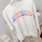 Retro Motherhood Sweatshirt in light grey with colorful retro collegiate lettering and a relaxed crewneck design