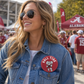 Roll Tide Elephant Pin red glossy button featuring a white elephant graphic and bold white lettering on denim