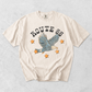 Route 66 eagle graphic tee in ivory cotton with distressed lettering, soaring eagle illustration, and orange stars