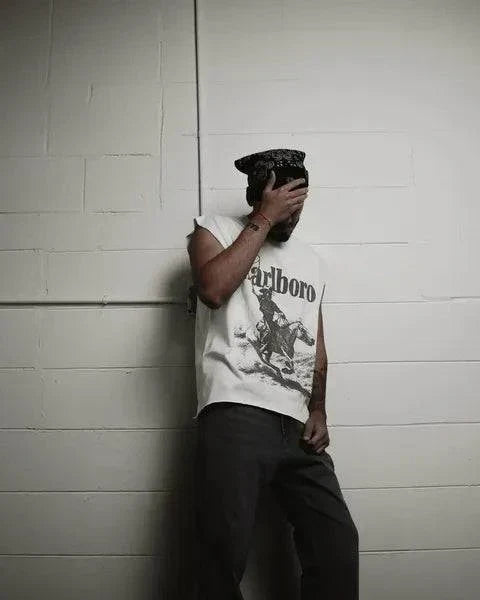 Rugged Man Cut Off Tee in vintage white cotton, featuring a distressed Marlboro graphic and raw armholes