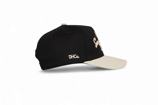 San Antonio Script Hat in black and beige with embroidered script lettering and a pre-curved brim