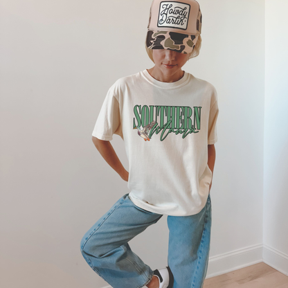 Southern Mama Tee white cotton T-shirt with green collegiate lettering and illustrated flying mallard graphic