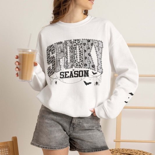 Unisex spooky season Halloween graphic crewneck sweatshirt with bats and spiderwebs