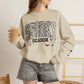 Unisex spooky season sweatshirt with Halloween bats and spiderweb graphics