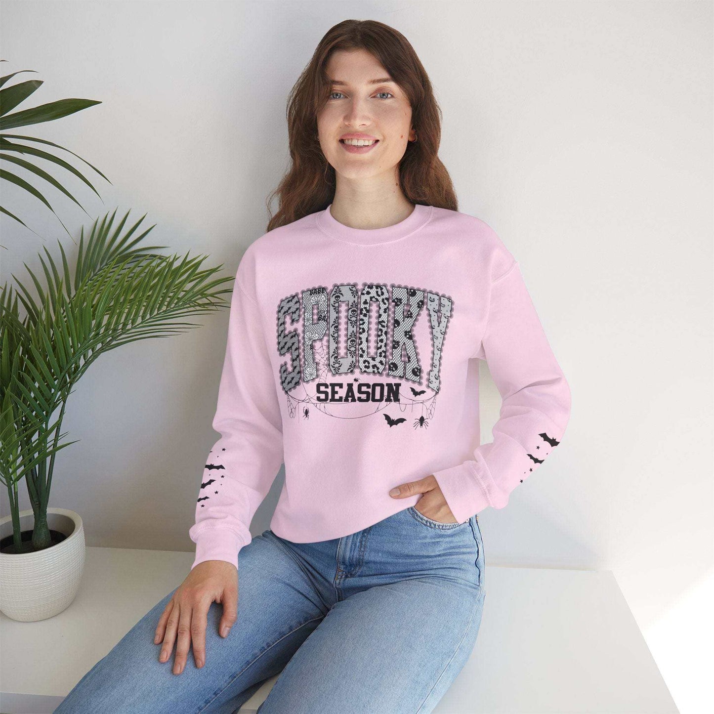 spooky season sweatshirt with halloween graphic and bats