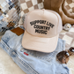 Support Live Country Music trucker hat in cream with bold black text, foam front and mesh back
