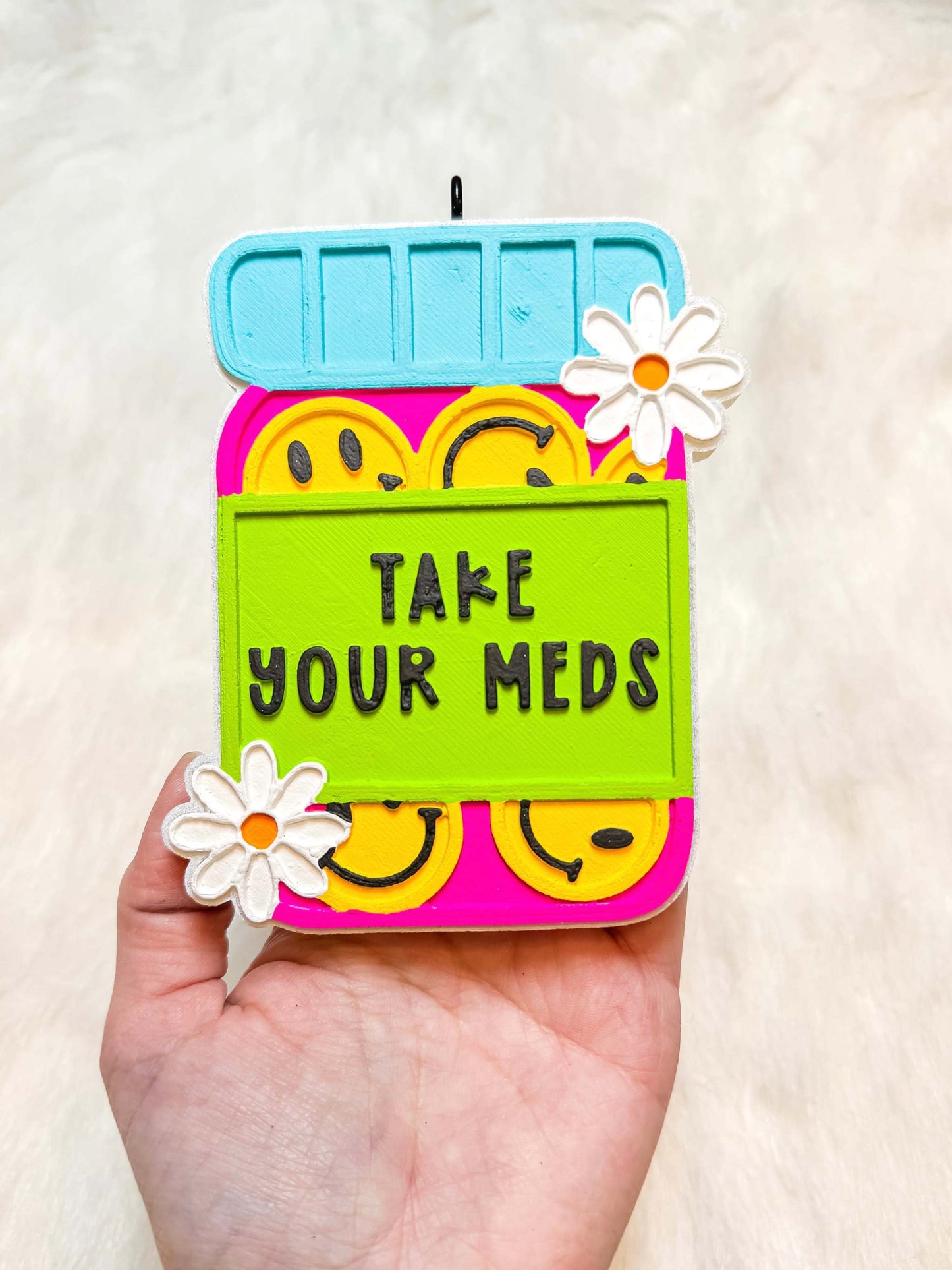 Take Your Meds Freshie in bright pink and neon green with smiley faces, daisies, and raised lettering