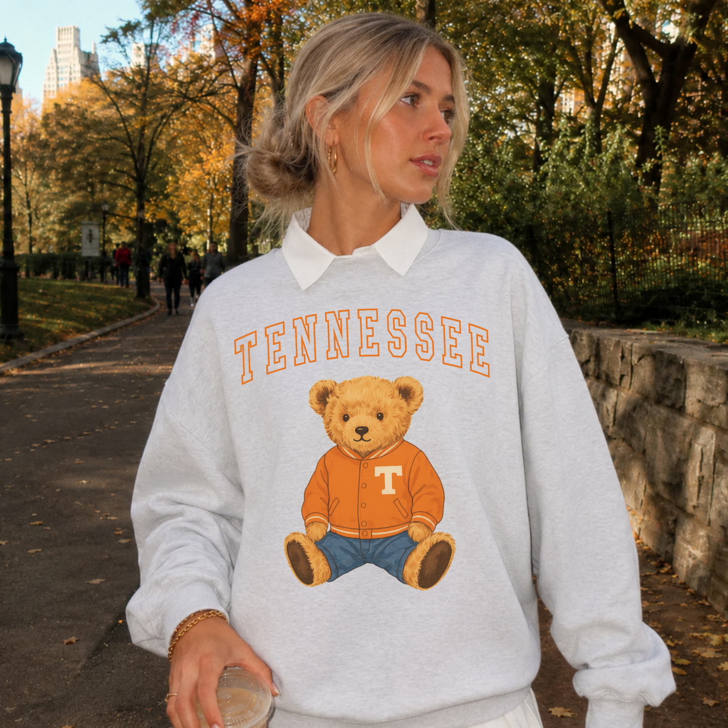 Tennessee Volunteers grey crewneck sweatshirt with orange teddy bear varsity graphic and arched Tennessee lettering