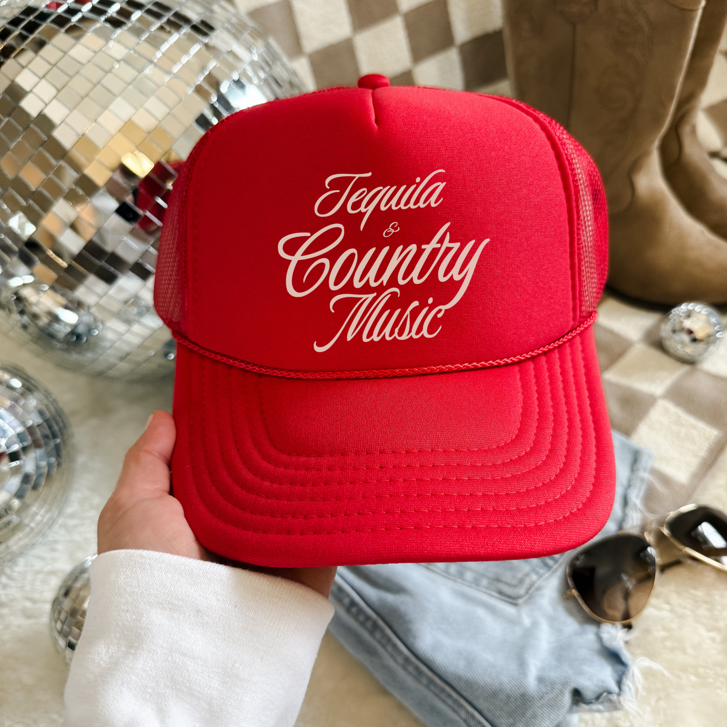 Trucker hat in red with structured fabric front and cream Tequila & Country Music script lettering