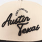 The "Austin" Script Hat in beige with black embroidered Austin Texas script and Keep It Weird lettering