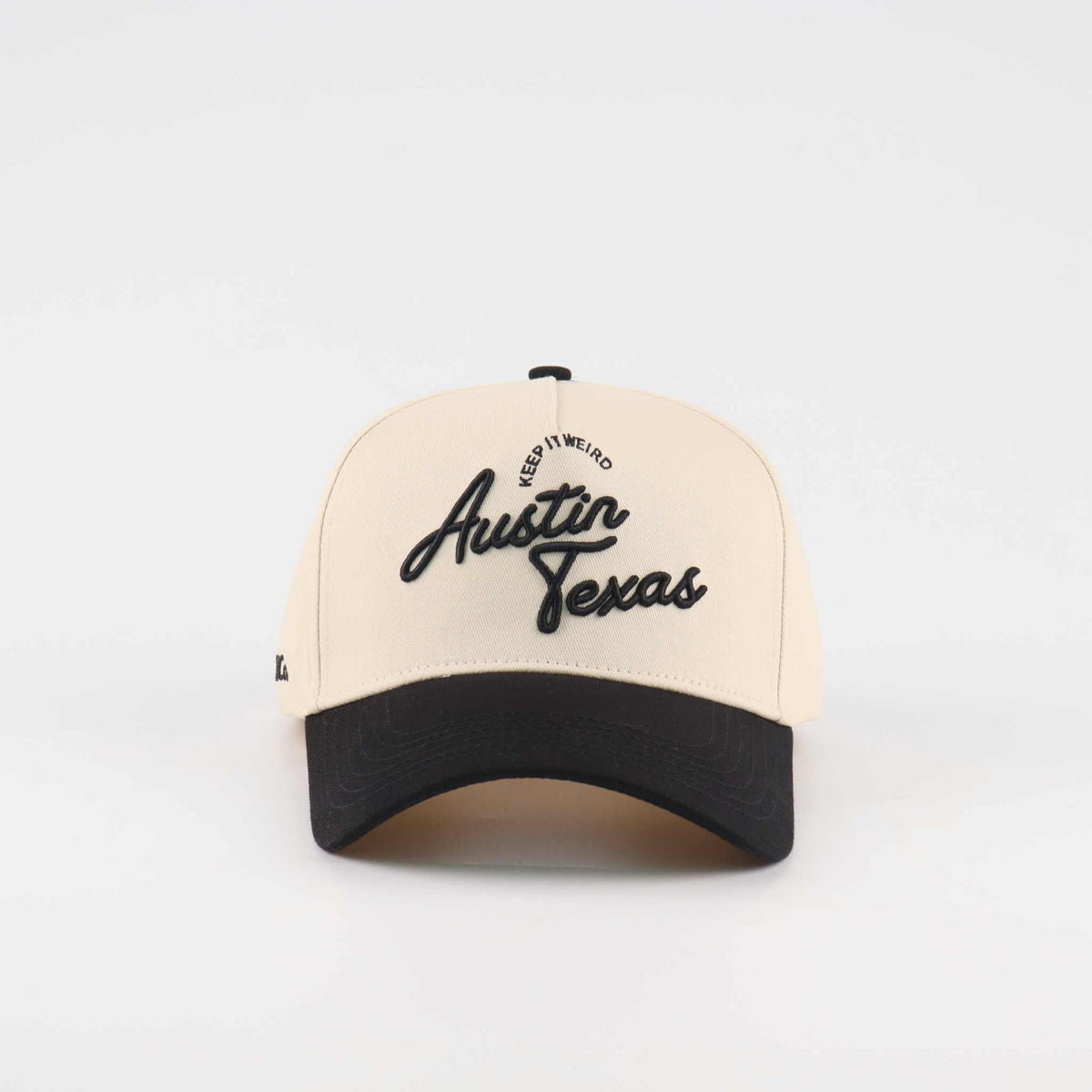 The "Austin" Script Hat, beige and black trucker cap with embroidered Austin Texas script and curved brim