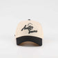 The "Austin" Script Hat, beige and black trucker cap with embroidered Austin Texas script and curved brim