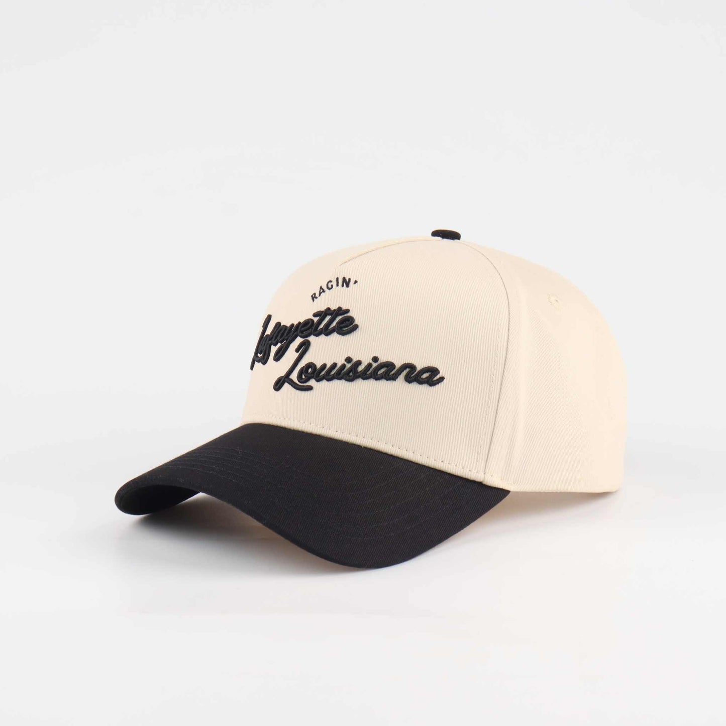 The Lafayette Script Hat in beige and black with embroidered Louisiana script and a pre-curved brim