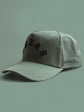 The Texas Performance Snapback olive green nylon cap with perforated side panels and raised Texas lettering